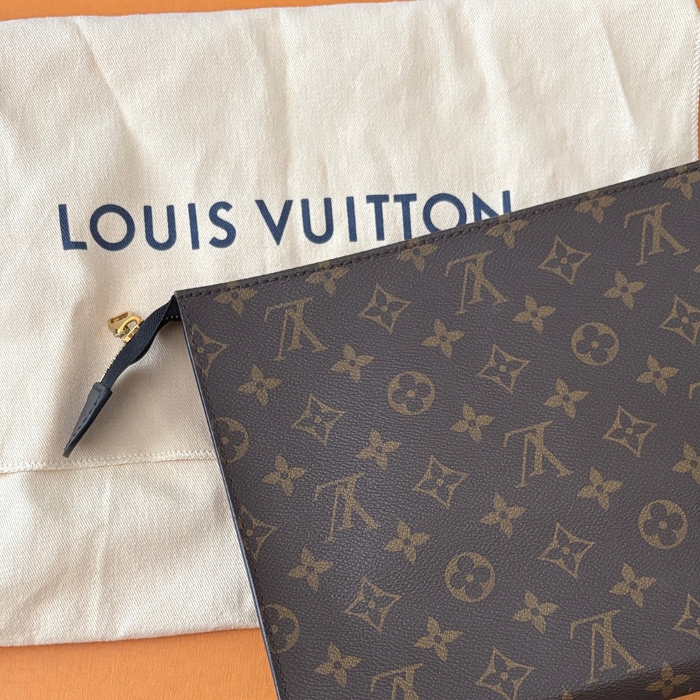 Authentic Louis Vuitton Poche Toilette with dust bag.